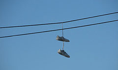 Shoestrings on an overhead line.